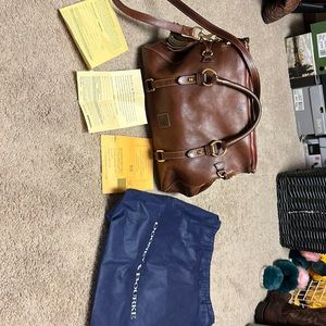 Gently used Dooney and Bourke Florentine satchel. Has dust cover and card